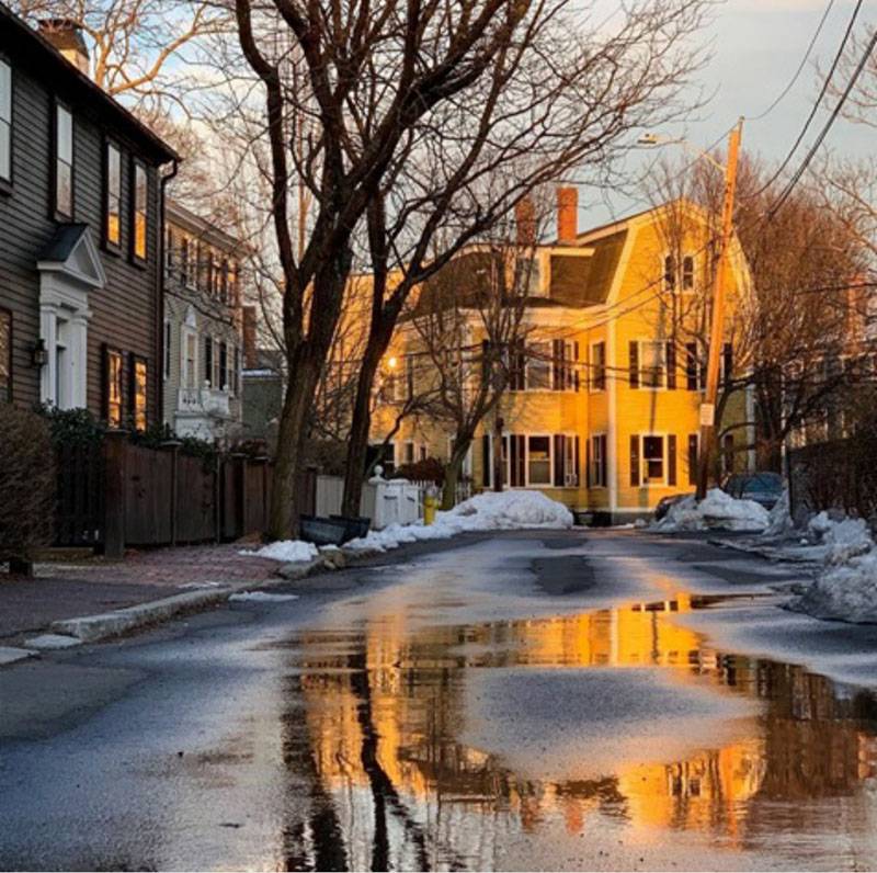 Reflection of yellow house on Federal Street in Salem, Massachusetts